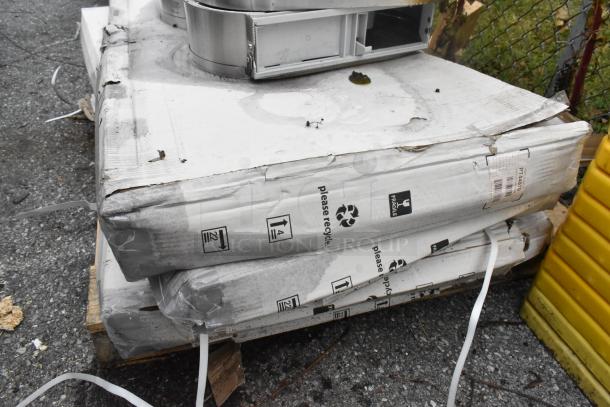 Nine-item lot with stainless steel toilet paper dispensers and PT44070 2'x4' LED light panel in original packaging.