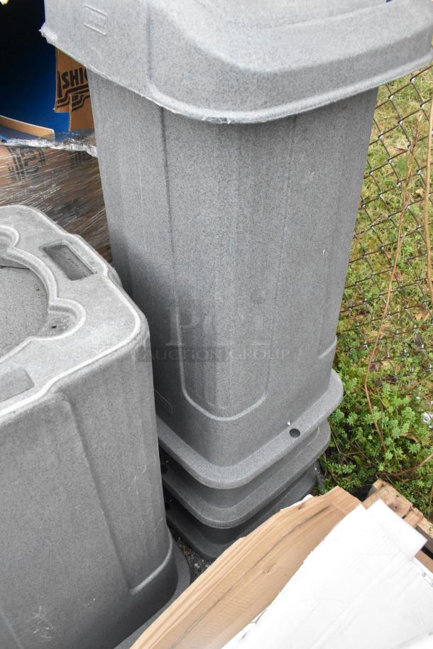Four durable gray poly trash cans, stackable design, gently used, ideal for bulk waste management, bid yields four units.