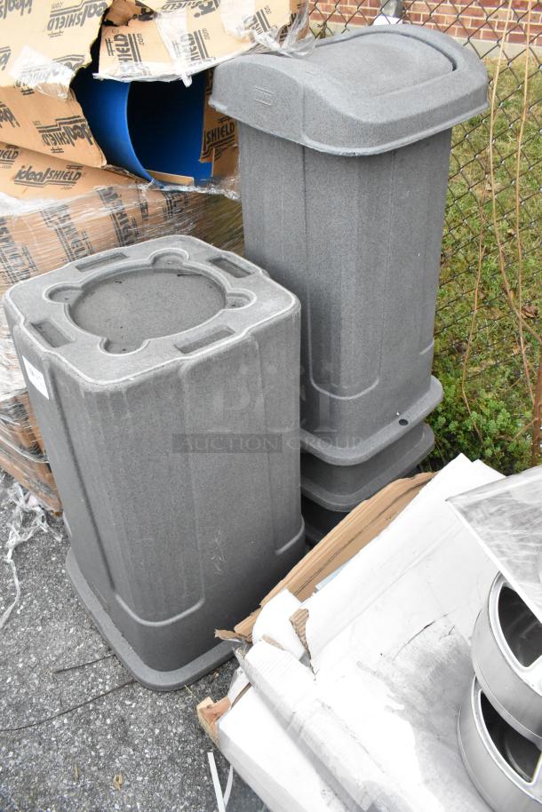 4 gray poly trash cans, durable construction, stackable design, excellent condition, ideal for commercial use.