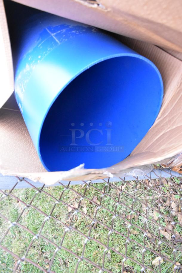 Eight new blue IdealShield poly bins, scratch and dent, visible in open cardboard boxes. Auction includes eight boxes.