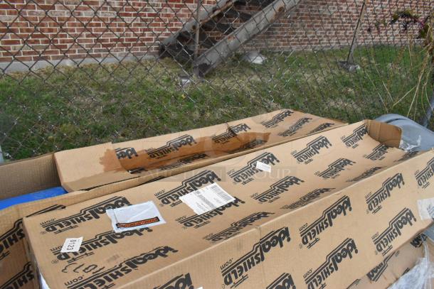 Eight IdealShield blue poly bins in original packaging, marked as scratch and dent, visible box labeling, brand new condition.