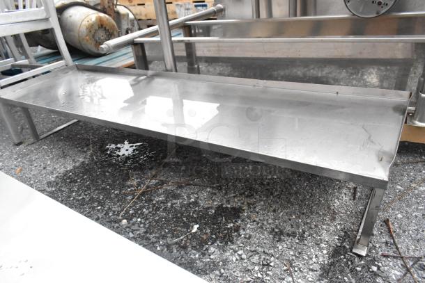 Two stainless steel over shelves, sturdy construction, reflective surface, used condition, suitable for commercial kitchens.