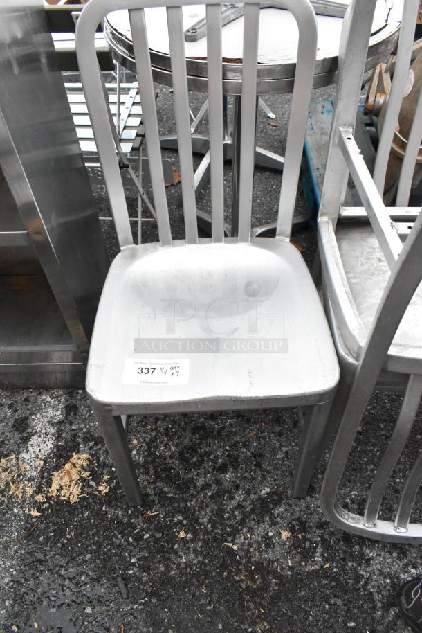 Gray metal dining chair, dining height, with vertical slat back design. Seven available. Tag shows auction lot number 337.