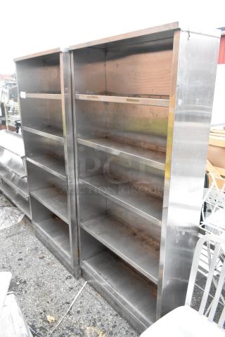 Two stainless steel shelving units, each with four shelves. Minor wear visible. Ideal for storage.