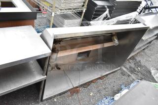 5' stainless steel grease hood, used, visible wear and discoloration, includes light fixtures, suitable for commercial kitchen.