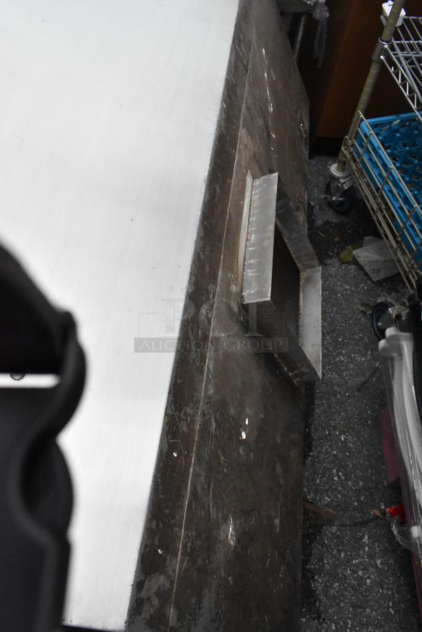 5' stainless steel grease hood, shows signs of use with surface marks; designed for commercial kitchen ventilation.