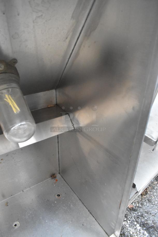 5' stainless steel grease hood in used condition, featuring sturdy construction and visible wear marks. No tags or labels visible.