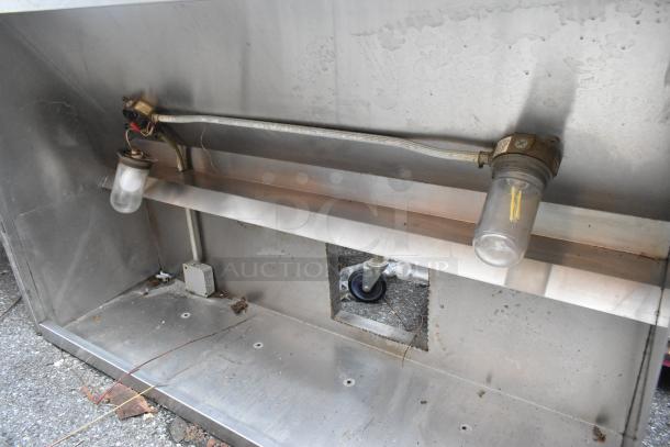 5' stainless steel grease hood, equipped with two light fixtures. Good condition with minor wear. Ideal for commercial kitchens.