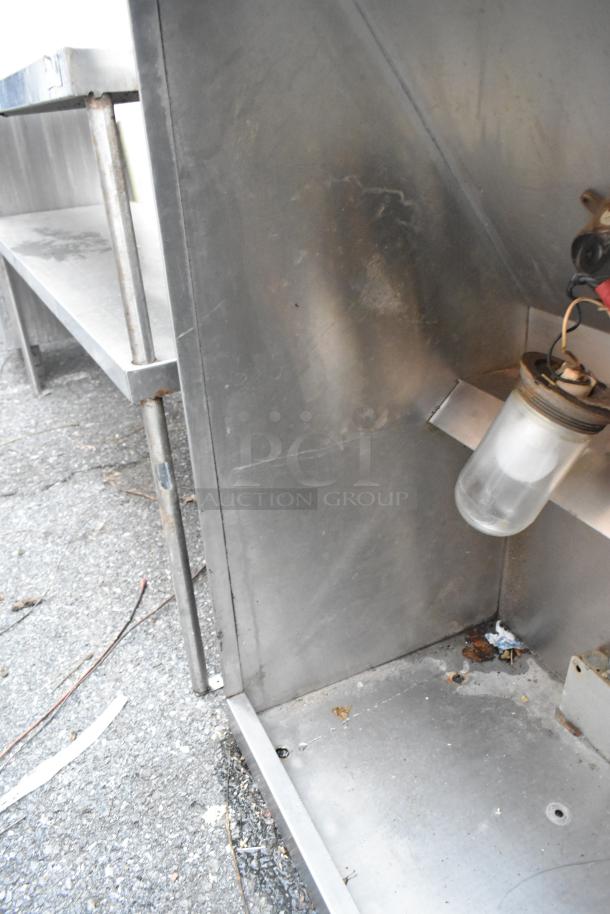 5' stainless steel grease hood, industrial-grade, shows signs of wear, visible mounting holes, and grease buildup.
