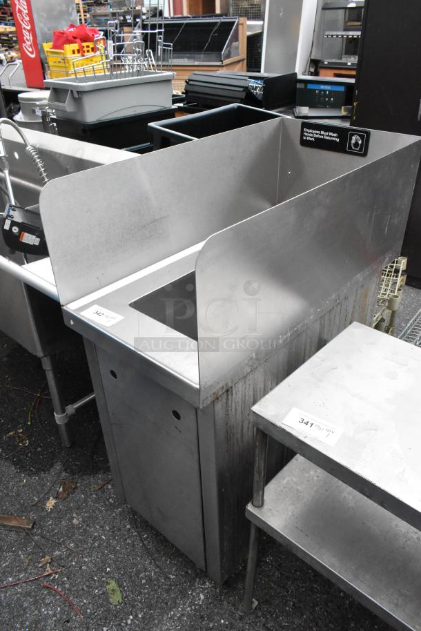 Stainless steel single bay sink with side splash guards, faucet, handles. Good condition, industrial use. Marked with washing reminder.