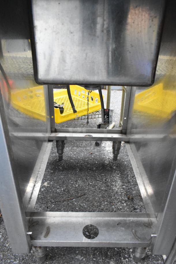 Stainless steel single bay sink with side splash guards, faucet, and handles, in fair condition. Tags show 20% discount.