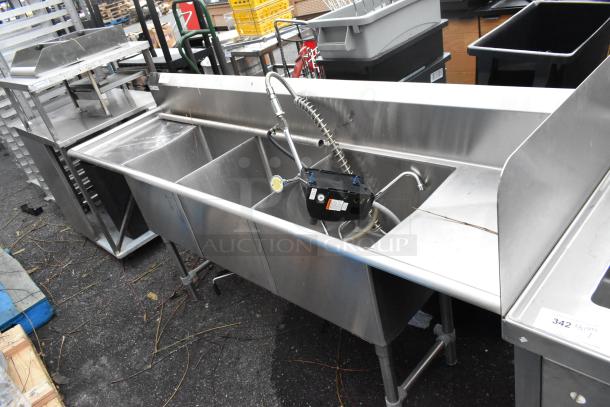 Stainless steel 3 bay sink with dual drain boards, commercial-grade, includes high-arc faucet, in good condition.