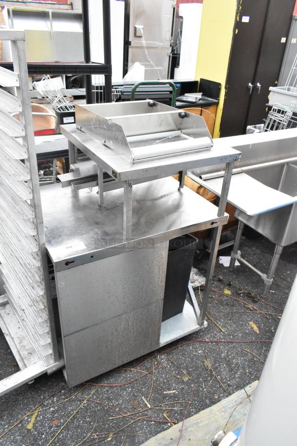Stainless steel commercial counter with over shelf, showing wear. Rust visible on lower panels. Tag marked "344".