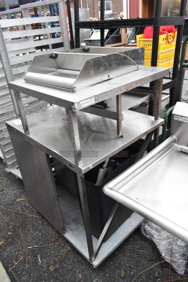 Stainless steel commercial counter with over shelf, features sturdy construction, shows some wear and rust, ideal for kitchen use.