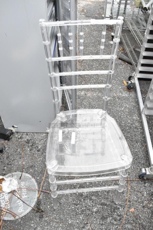 Clear poly stackable Chiavari chair, excellent condition. Transparent design with sturdy frame. Auction includes three chairs.