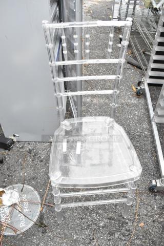 Clear poly stackable Chiavari chair, excellent condition. Transparent design with sturdy frame. Auction includes three chairs.