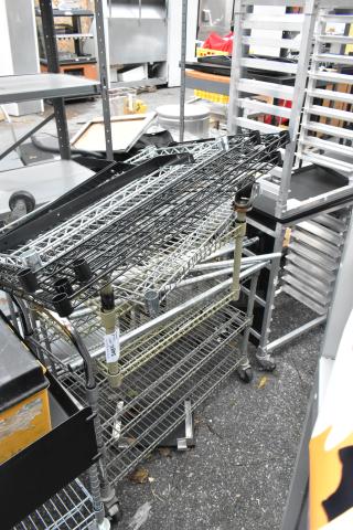 Two wire shelving units with mixed wire shelves, casters, and various contents. Includes tag with number 348. Secure, durable condition.