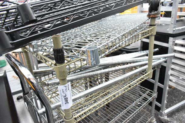 Two wire shelving units with metal grid shelves, beige and silver frame. Auction lot tag visible, labeled "348."