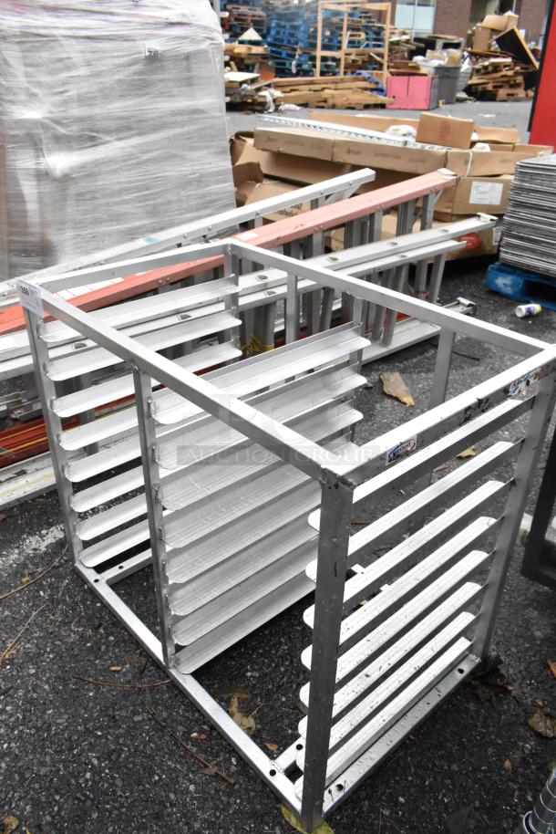 Metal double pan rack with multiple shelves, slightly weathered, ideal for commercial kitchen use.