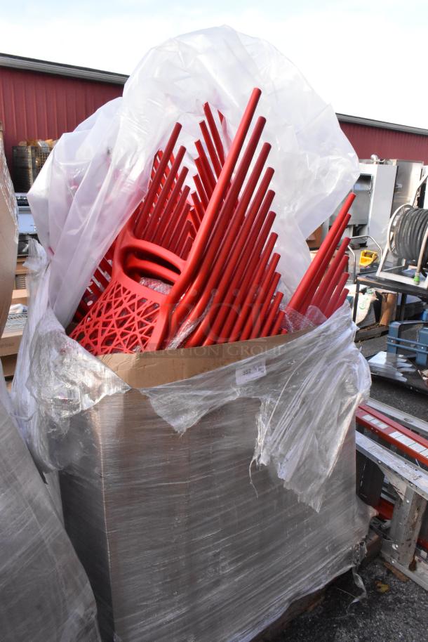 Red poly dining height chairs in a wrapped pallet. Scratch and dent condition, 18 chairs included in auction lot.