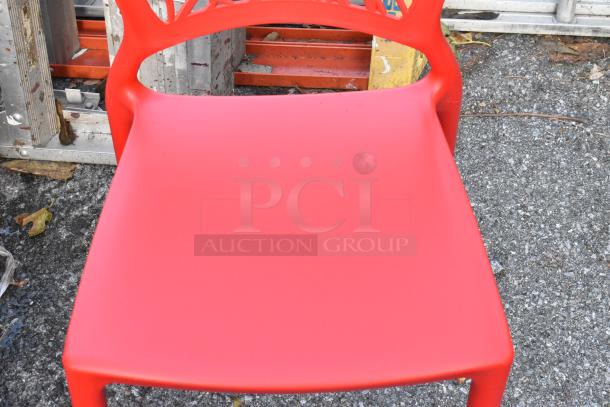 Red poly dining height chair, scratch and dent condition, outdoor setting, modern design, 18 available for auction.