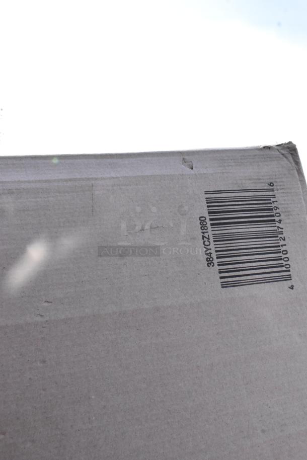 Cardboard box with a barcode labeled "384YCZ1860," indicating Lancaster Table & Seating folding table.