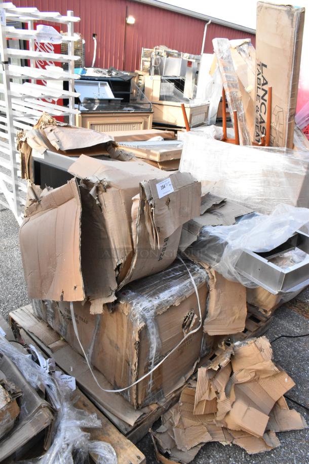 Five new "scratch and dent" items in damaged packaging, including Regency stainless steel products and Lavex dispenser.