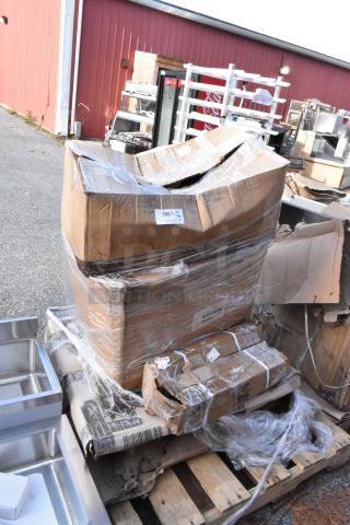 Stack of six new items in original packaging with visible damage. Includes Sirman meat tenderizer and Norlake evaporator coil. Tags indicate lot numbers.