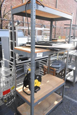 Gray metal shelving unit with two wooden shelves, used condition, label indicates "360." Includes wooden 2-tier cart on casters.