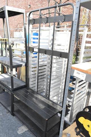 Black metal shoe rack with integrated coat hanging rack, featuring sturdy hooks and shelves. Good condition.