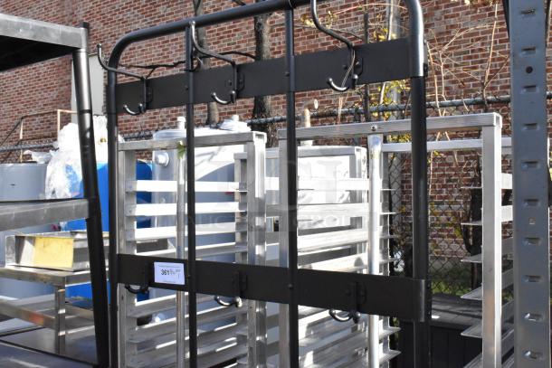 Black metal shoe rack with coat hanging rack, features multiple hooks. Appears in good condition with label marked "361".