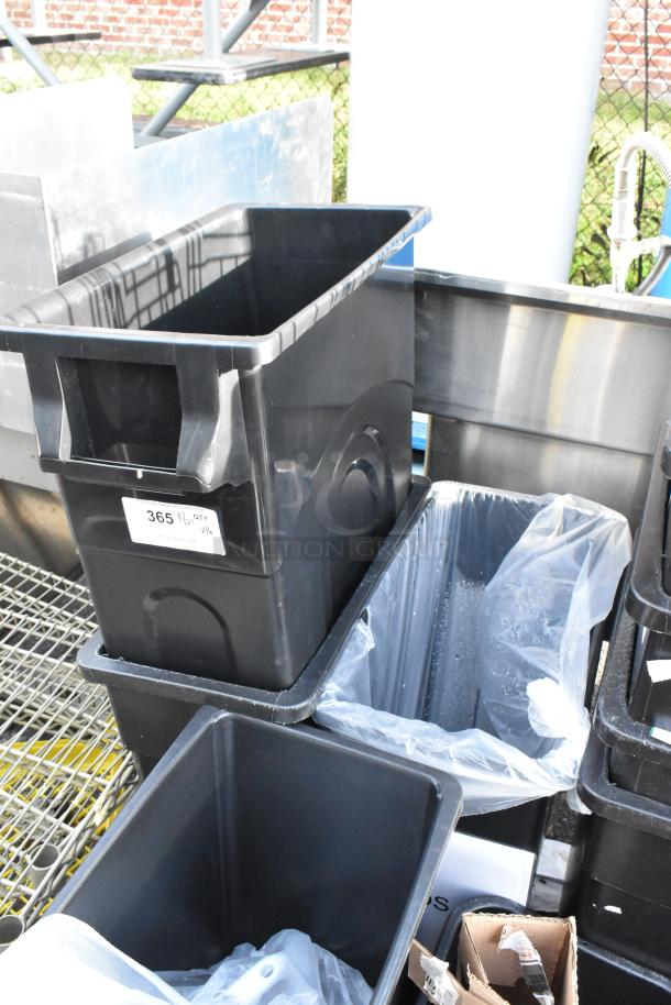 16 black poly trash cans with a stackable design and sturdy build, labeled "365 WT QTY 16".