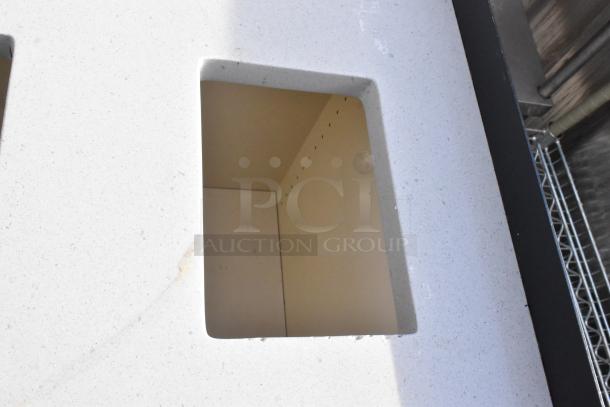 Trash can shell with speckled surface, featuring three trash deposit holes and two wood pattern doors, shown in detail.