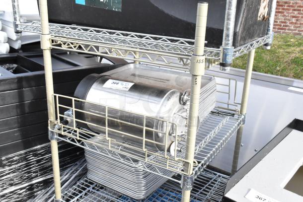 Commercial wire shelving unit on casters, includes contents like a stainless steel container. Buyer must dismantle.