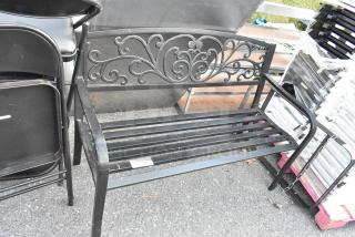 Black metal bench with armrests, ornate backrest design, slatted seat, good condition, item tag labeled "371".