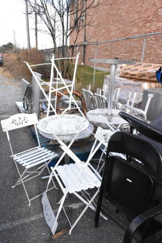 Assorted 13 items including white folding chairs, tables, and metal furniture pieces in used condition, outdoor setting.