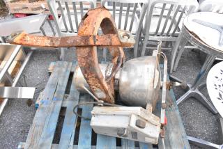 Rusty Hobart Cutter Mixer on a blue pallet. Visible wear and corrosion; potential restoration project. Model tag displayed.