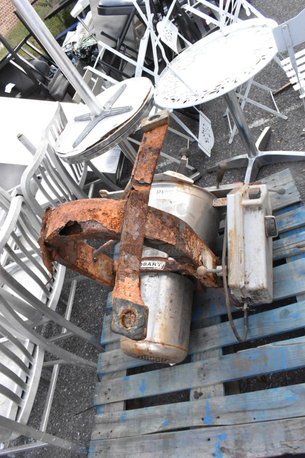 Rusty Hobart Cutter Mixer on wooden pallet, showing significant wear. Model label visible, requires restoration.