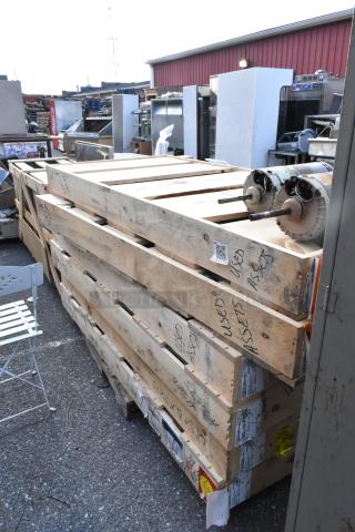 Eight brand new Anthony doors in crates, size 29-1/16"x66-9/16", high value for multiple bids, labeled "USED ASSETS."