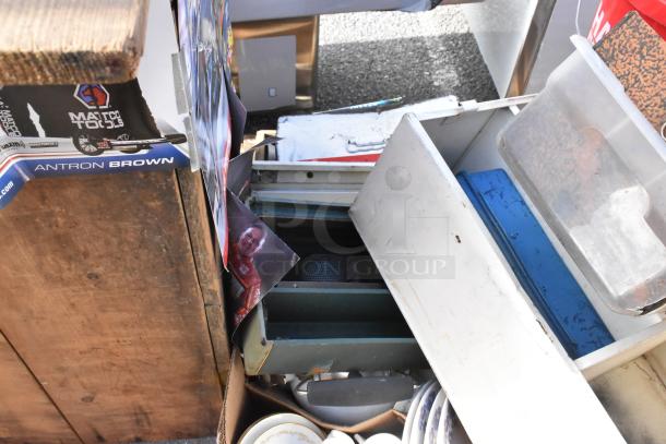 Pallet with assorted items including dishes, plastic bins, a blue toolbox, and a Matco Tools box. Various conditions.