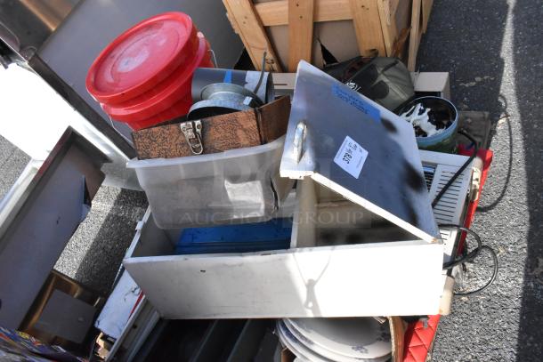 Pallet lot of assorted items including red lidded buckets, plastic bins, ceramic dishes, and a metal box with visible wear.