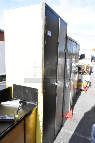 Three 2-door cabinets in varying colors, outdoor setting. Visible wear, metal construction, suitable for storage.