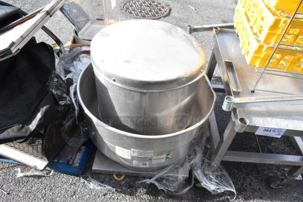 Greenheck CUBE-161-7-X metal commercial rooftop mushroom exhaust fan, used condition, visible safety and model labels.