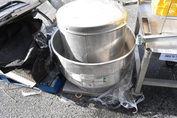 Greenheck CUBE-161-7-X metal rooftop mushroom exhaust fan, used, with visible product labels detailing specifications.