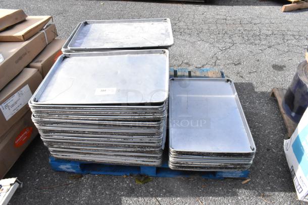 Stack of 103 full-size metal baking pans on a blue pallet. Slightly worn condition, ideal for bulk purchase.