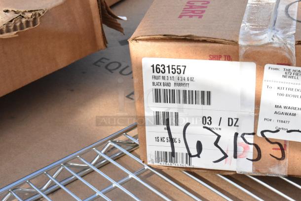 Box labeled "1631557" on wire shelf, featuring shipping labels and barcodes. Scratch and dent condition.