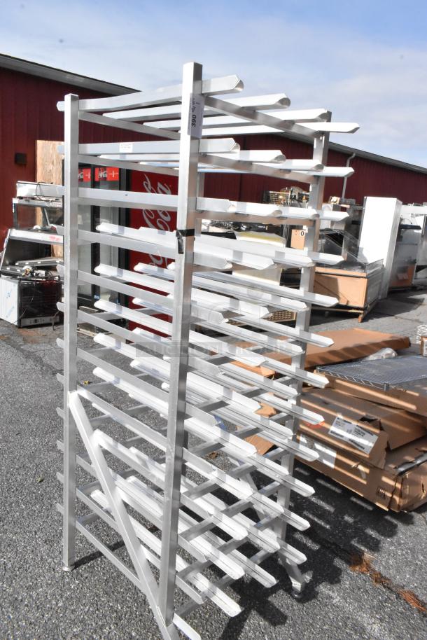 Metal #10 can rack, sturdy aluminum frame, multiple angled shelves for optimal storage, outdoor lot setting.