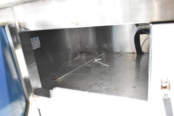 Leader LB84 Stainless Steel 3 Door Undercounter Cooler interior. Some wear visible. Model and electrical label attached.