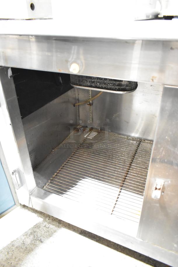 Leader LB84 Stainless Steel 3 Door Undercounter Cooler, commercial-grade, showing open interior with wire rack, 115V.