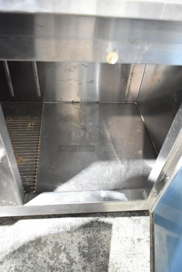 Leader LB84 stainless steel 3-door undercounter cooler, interior view showing storage space, 115V, 1 Phase.